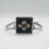 Brăţară inox, model floare pe fundal negru - imagine 2
